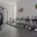 Fitness center with high ceilings and cardio machines
