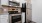 Stainless steel appliances and white cabinetry